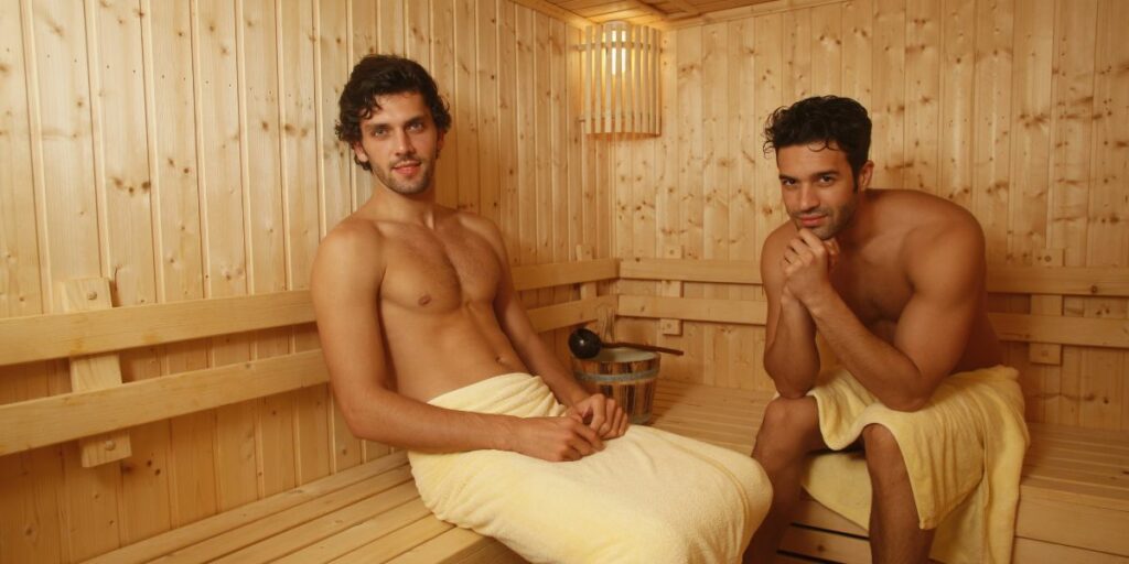 Two men relaxing and enjoying a session at the best gay sauna in london.